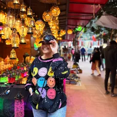 Having fun at Dilli Haat. I love the vibrant atmosphere, and my colorful smiley-face sweatshirt perfectly matched the mood.