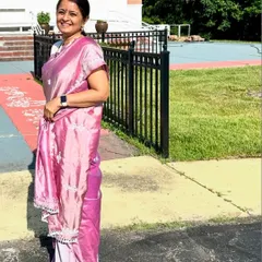 Another photo of the client at a temple, looking elegant in her custom-embroidered saree. It is an honor to be trusted with such special projects.