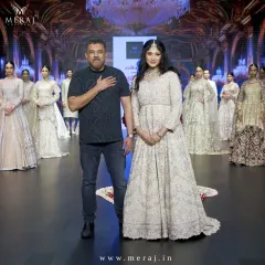 A proud moment on the runway with my showstopper, showcasing the spectacular tail gown that redefines luxury and elegance.