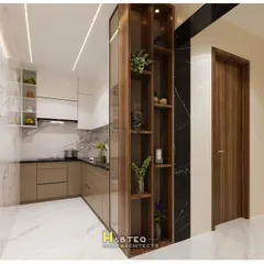 This view shows how the glass and wood pantry unit acts as a stylish partition between the kitchen and the adjoining area, providing storage while maintaining an open feel.