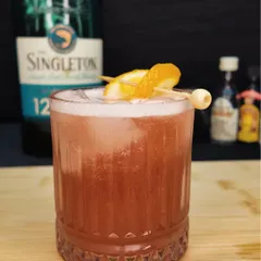 This is my Whisky Scarlett cocktail, a fruit-forward drink made with Singleton single malt. It's a refreshing blend of whisky, orange, pineapple, and cranberry juice.