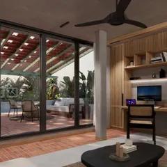 The library and home office at HAUS 5 opens completely onto a lush, covered terrace. This seamless transition extends the living space and allows for work and relaxation surrounded by nature.