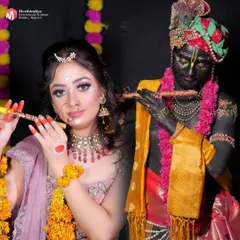 The full depiction of Radha and Krishna, showcasing the complete character transformation through makeup, costume, and props.