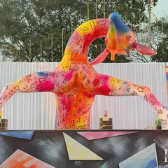 This giant, rainbow-hued giraffe sculpture was a centerpiece of the event, embodying the whimsical and larger-than-life spirit of the carnival theme. It served as a landmark and a favorite photo opportunity for guests.