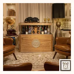 The Treasure Chest is more than just a bar, it's a work of art. This automated hidden bar, crafted from solid wood with a vintage-inspired medallion, uses Swiss technology to conceal a collection of up to 25 bottles and accessories.