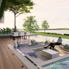 This sunken seating area, part of a private waterfront residence, is designed for intimate gatherings by the infinity pool. The space offers uninterrupted views of the Gurupura river, blending the comfort of a bespoke home with the tranquility of the natural landscape.