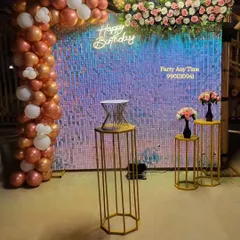 My shimmer sequin walls are available for rent and make a great photo backdrop. Here, I've paired an iridescent shimmer wall with a rose gold and white balloon arch, a floral arrangement, and a neon sign for a surprise birthday at a resort in Kanakapura.