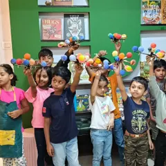 Our little astronomers proudly hold up the solar system models they built and painted. It is a fantastic project that they get to take home and show off.