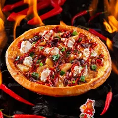 A "devilishly" good pizza from Hundo, surrounded by flames, hot peppers, and a devil's pitchfork. This playful yet dramatic setup reinforces the brand's spicy and rebellious identity.