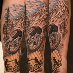 A story of father and son, told through realism. This forearm piece captures the dynamic action of mountain biking, complete with realistic terrain and a touching silhouette of their bond.
