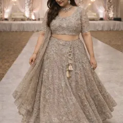 This plus-size lehenga is designed to make you feel fabulous. The intricate threadwork and sequins create a rich texture, ensuring you look your best at any wedding or festive occasion.