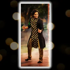 A professional shot of me in a black and gold kurta, captured mid-performance during a wedding event. I love bringing my energy directly to the stage.