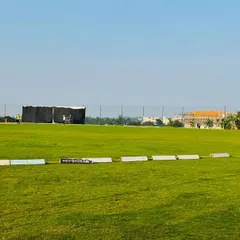The ground is always maintained in match-ready condition. This photo shows the clear boundary lines, the sight screen, and the well-kept pitch, ready for the day's play.