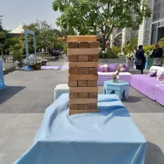 A Giant Jenga tower set up at an outdoor wedding event in Delhi. It provides a relaxed and fun activity for guests to enjoy between ceremonies.
