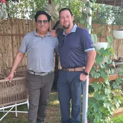 A visiting PGA Pro, Mathew Reise, poses with a member of our team, sharing knowledge and enthusiasm for the growth of golf in India.