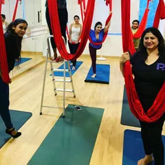 A wonderful group of women getting ready to fly in an aerial yoga class. The energy in the studio is always so supportive and encouraging, especially when trying something new together.