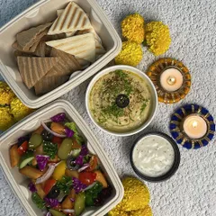 Our Pita Hummus Veg Meal is a party favourite for Diwali. It comes with creamy hummus, fresh salad, and soft grilled pita bread, making it a light yet satisfying meal for your festive gatherings.
