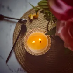 The warm glow of the dual wicks in my Crystal Jar Candle. This ensures an even wax pool, which provides the best possible fragrance throw to fill your room.