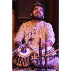The joy of playing is a feeling like no other. This photo captures a moment of pure happiness during a performance.
