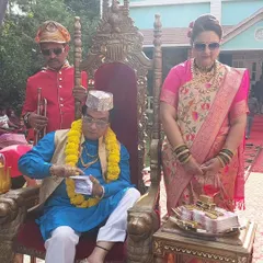 A scene from the lottery ad shoot. I styled the entire cast to create a rich, celebratory atmosphere, complete with a throne, gold bars, and vibrant traditional outfits.