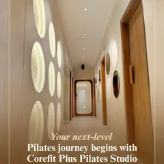 This hallway, with its calming decor and soft lighting, leads you toward our practice rooms. It represents the start of your next-level Pilates journey with us.