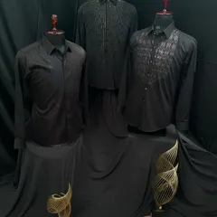 A trio of my black designer shirts. Each one features a unique embellishment, from cascading beads to a geometric bib, showcasing different ways I use handwork to elevate a classic black shirt.