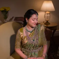 A serene moment of the mom-to-be. Her custom blouse and beautiful saree create a look of timeless elegance for her baby shower.