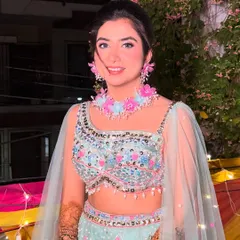 The complete look for Surbhi's Mehendi. The light, dewy makeup ensures she looks radiant and feels comfortable.