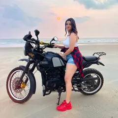 Coming soon! A sneak peek from a new song shoot in Goa, posing on a Royal Enfield Himalayan on the beach.