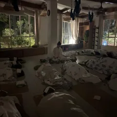 Another view of our sound healing session, where participants lie in Savasana, covered and comfortable. This posture allows for complete surrender, enabling the sound vibrations to work on a deep cellular level for healing.