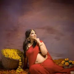A modern goddess. Seated amidst a field of marigolds with a basket of flowers beside her, this portrait is a powerful and beautiful celebration of life, color, and cultural roots.