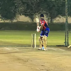 IPL all-rounder Rishi Dhawan gets ready to face bowlers during a night practice session. Our well-lit pitches allow for extended training hours, a crucial advantage for professional athletes.