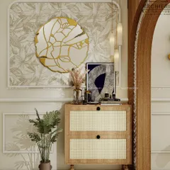 A close-up of a foyer with a rattan-fronted console, a unique gold-framed mirror, and botanical wallpaper, creating a warm and soulful entrance.