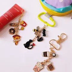 A collection of custom charm keychains that match your vibe. This image features a foodie chain, a coffee and boba lover's chain, and an animal-themed chain.