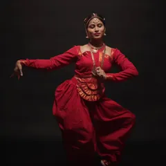 A graceful and powerful stance. This portrait showcases the elegance and strength required for classical dance, with every detail from her posture to her expression perfectly captured.