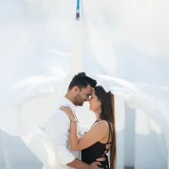 This pre-wedding shot for Jui and Vaikrant uses simple elements like flowing white fabric to create a dramatic and timeless portrait. It’s a great example of how we can achieve a high-fashion, cinematic look in a natural setting.
