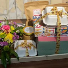 This hamper is a full meal experience. It combines my bento cakes and other sweets with savoury items, all beautifully packaged and tied together with a festive ribbon, complete with a fresh flower bouquet.