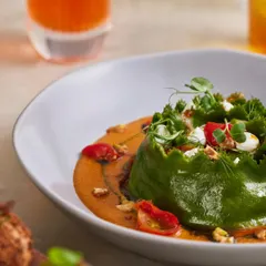 Our Spinach and Ricotta Crown Ravioli is a true signature. The pasta is handmade, of course, nestled in a charred tomato and miso sauce with toasted walnuts and goat's cheese for a hearty, comforting bowl.