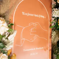 "It's a forever kind of thing." A custom welcome sign we designed for Yeshaswini and Shashank's engagement. The simple line art and warm terracotta color perfectly captured the modern, romantic vibe of their celebration.