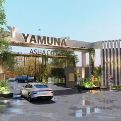 The grand entrance gate for the Yamuna Asha City development. The design uses clean lines, integrated planters with climbing greenery, and prominent branding to create a modern and inviting gateway that sets a premium tone for the entire community.