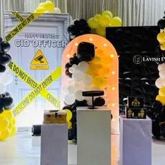 A unique CID Officer themed party, complete with a "Crime Scene Do Not Enter" backdrop, a 3D textured wall, and a yellow and black color scheme. We planned and executed this in just 5 hours!