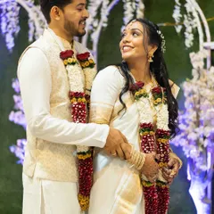 A lovely and happy couple during their Christian wedding ceremony. The bride's elegant and natural look perfectly complements the groom's classic attire.