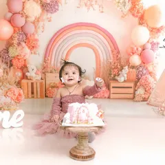 The pure delight of a first birthday cake smash. This image captures the joy and mess that makes these sessions so memorable.