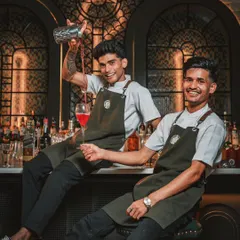 Meet the alchemists behind my bar. They don't just pour drinks; they craft joy, one artisanal cocktail at a time. Their energy and skill are a key part of any celebration at the mansion.
