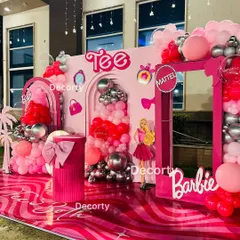 An angled shot of the Barbie stage, highlighting the glossy, patterned floor and the fun palm tree cutouts that add a Malibu vibe.