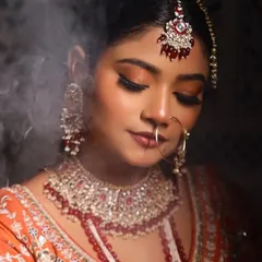 Another angle of the Nikkah glam, with a smoky effect in the background. The makeup is flawless, with a focus on the eyes and a perfectly defined lip.