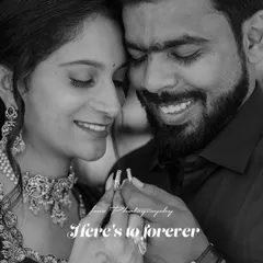 A beautiful black and white close up of a smiling couple holding their engagement rings. The lack of color emphasizes their expressions and the sparkle of the jewelry.