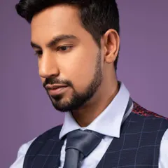 A close-up professional portrait. The lighting is soft but directional, highlighting the features without harsh shadows. This is a great look for a LinkedIn profile.