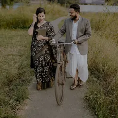 A retro-themed pre-wedding shoot with a vintage bicycle in a rustic setting. This shows how we can create a unique, old-world charm for your photos.