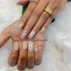 An elegant and modern design using gold chrome. I created a "frame" effect with the chrome around the edge of the nail and added a delicate 3D white flower as an accent.